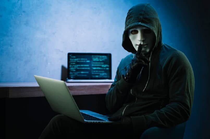 person-white-mask-laptop-hand_13272-2668590